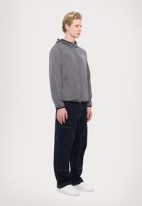 EA7 Emporio Armani TRAIN CORE JACKET - Lengva striukė - volcanic glass