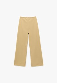 Spodnie o szerokich nogawkach w miękkim beżowym materiale, z gładką fakturą i wysokim stanem, o czystym, minimalistycznym designie.