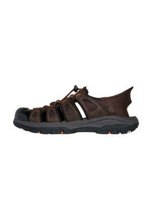 Brown outdoor sandals with open mesh design, rubber sole, and adjustable lace. Features protective toe cap and orange accents on sole.
