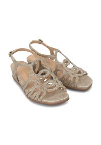 Sandali wedge beige con ritagli decorativi e abbellimenti scintillanti. Design open toe con cinturino alla caviglia e soletta imbottita.