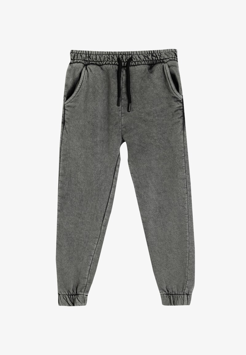 Housut harmaita pehmeästä kankaasta, joissa on joustava vyötärö, kiristettävä nauha, kaksi sivutaskua ja joustavat resorit nilkoissa.