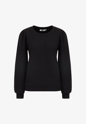 Melnā sporta jakā ir teksturēta auduma virsma, noapaļots apkakles kakls un garas piedurknes. Tai ir savilktas detaļas plecos un ribotas aproces un apakšmala.