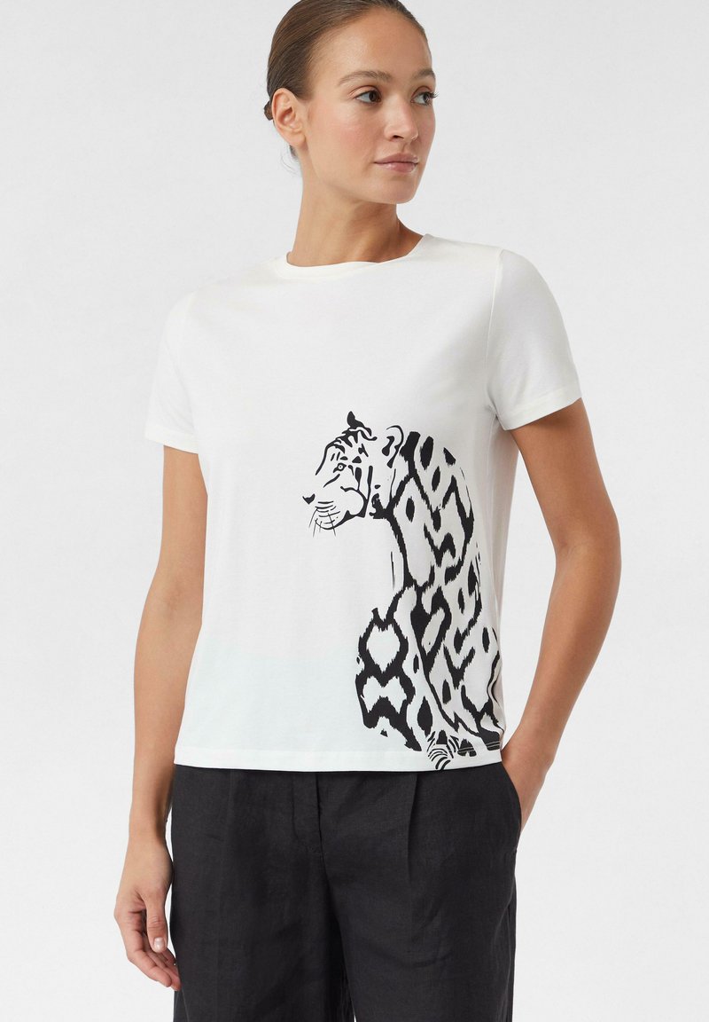 White cotton t-shirt featuring a black tiger graphic with geometric patterns along the side. Short sleeves and a round neckline.