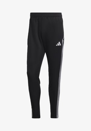 Pantalons de sport noirs à coupe ajustée, avec une taille élastique et trois rayures blanches de chaque côté. Présente un logo Adidas en blanc.