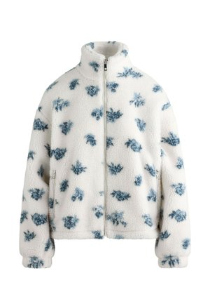 White fleece jacket with blue floral pattern, high collar, full front zip, and elastic cuffs. Soft texture and relaxed fit.