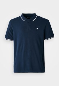Tumedast sinine puuvillane polo särk klassikalise kraega, kolme nupuga ja valgete triipudega varrukatel. Särgil on väike valge logo.
