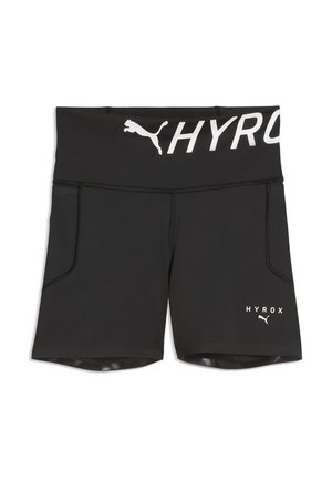 Shorts de sport noirs avec une large ceinture, présentant le logo Puma blanc et un texte "HYROX" partiellement visible sur la ceinture et la jambe.
