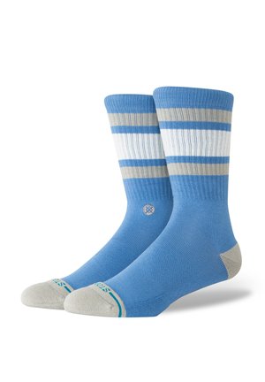Blaue Socken mit hellblauen und beigen horizontalen Streifen. Mit gerippten Bündchen und verstärkter Spitze. Weicher Stoff mit glatter Textur.