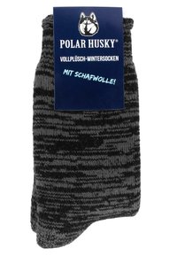 Schwarz-grau gestreifte Wintersocken aus plüschiger Wolle, mit einer weichen Textur und einem umklappbaren Bündchen; verpackt mit einem Markenetikett.