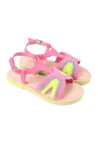 Sandali sintetici rosa con dettagli arcobaleno in crochet colorato. Suola rosa chiaro con un accento giallo. Cinturino regolabile alla caviglia.