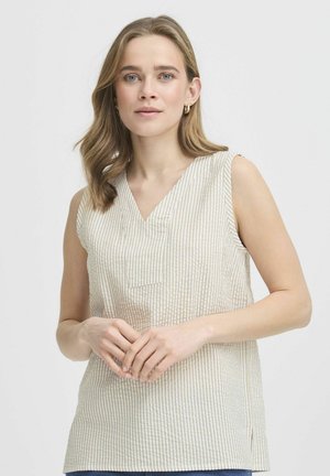 Débardeur sans manches en beige clair avec un motif rayé vertical. Dispose d'un col en V et d'une petite poche avant. Tissu doux et texturé.
