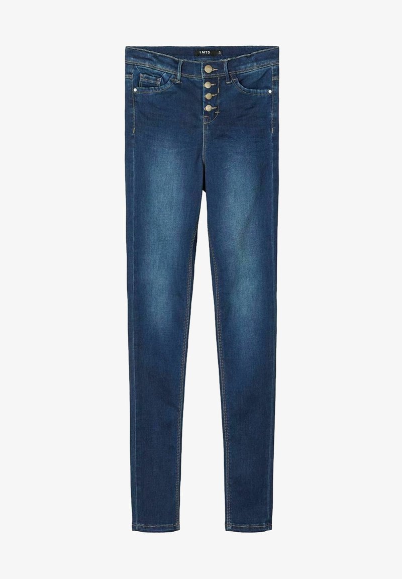 Jean skinny bleu foncé avec boutonnière à boutons, poches avant et poche monnaie, coutures contrastantes, étalé à plat sur un fond blanc.