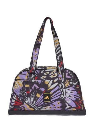 Multicolored butterfly print bag with black accents and sturdy straps. Fabric exterior, rounded shape, and a front logo patch.