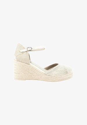 Zapato de cuña espadrille en beige claro con parte superior de tejido texturizado, tira al tobillo y tacón de yute trenzado. Diseño de puntera redonda.