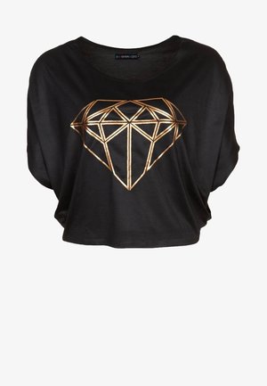 Czarna, luźna bluzka z krótkim rękawem, z dużym złotym graficznym diamentem z przodu, wykonana z miękkiego materiału.