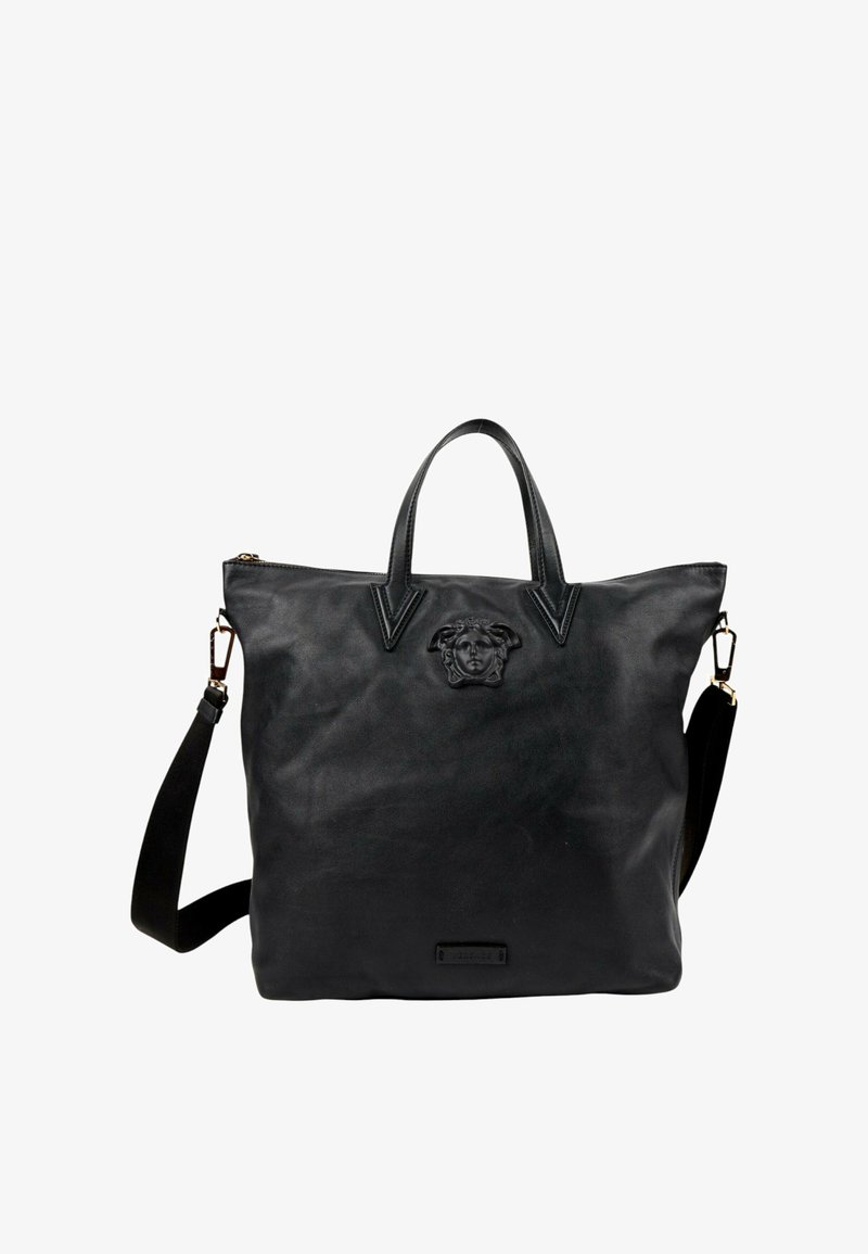 Sac à main en cuir noir avec doubles poignées supérieures, bandoulière réglable et logo embossé tête de Méduse au centre avant.