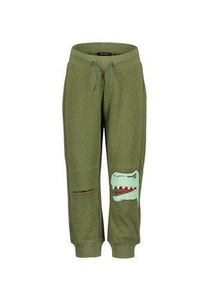 Pantaloni della tuta verde oliva realizzati in tessuto morbido, con una grafica di un dinosauro sulla gamba sinistra, fessure sulle ginocchia e vita elasticizzata.
