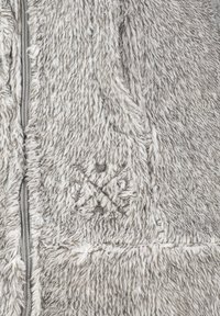 Gray, fuzzy outerwear with a textured finish, featuring a zipper closure and subtle embroidered detail near the bottom.