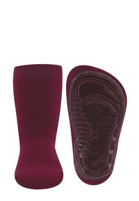 Bordowe skarpetki o miękkim, teksturowanym splocie i trwałej gumowej podeszwie. Podeszwa ma wytłoczenie z wypukłym wzorem zapewniającym przyczepność.