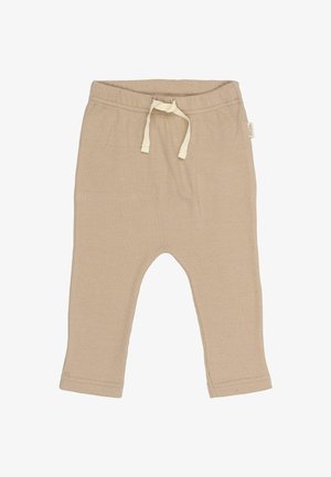 Pantaloni de bumbac bej cu o textură ribbed, talie elastică și șnur. Au picioare conice și tivuri cusute.