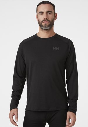 Zwarte lange mouwen sportshirt, gladde stof, ronde halslijn, tonale logo op de borst, aansluitende pasvorm met iets gestructureerde accenten op de mouwen.