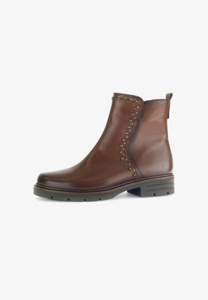 Braune Leder-Stiefeletten mit dekorativen Nieten an der Seite, einer runden Zehenpartie und einem niedrigen Blockabsatz. Profilierte Gummisohle für besseren Halt.
