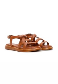 Brown leather sandals with cross-strap design, open toe, cushioned insole, and adjustable ankle strap. Lightweight rubber sole.
