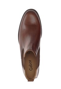 Bottine en cuir marron avec une finition lisse, des panneaux latéraux en élastique et une pointe arrondie. Semelle intérieure marquée "Gabor" et taille 41.