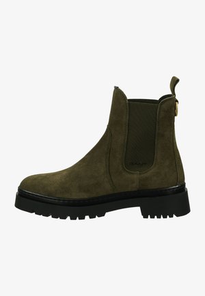 Green suede Chelsea boot with elastic side panels, a pull tab, and a chunky black rubber sole featuring treads for traction.