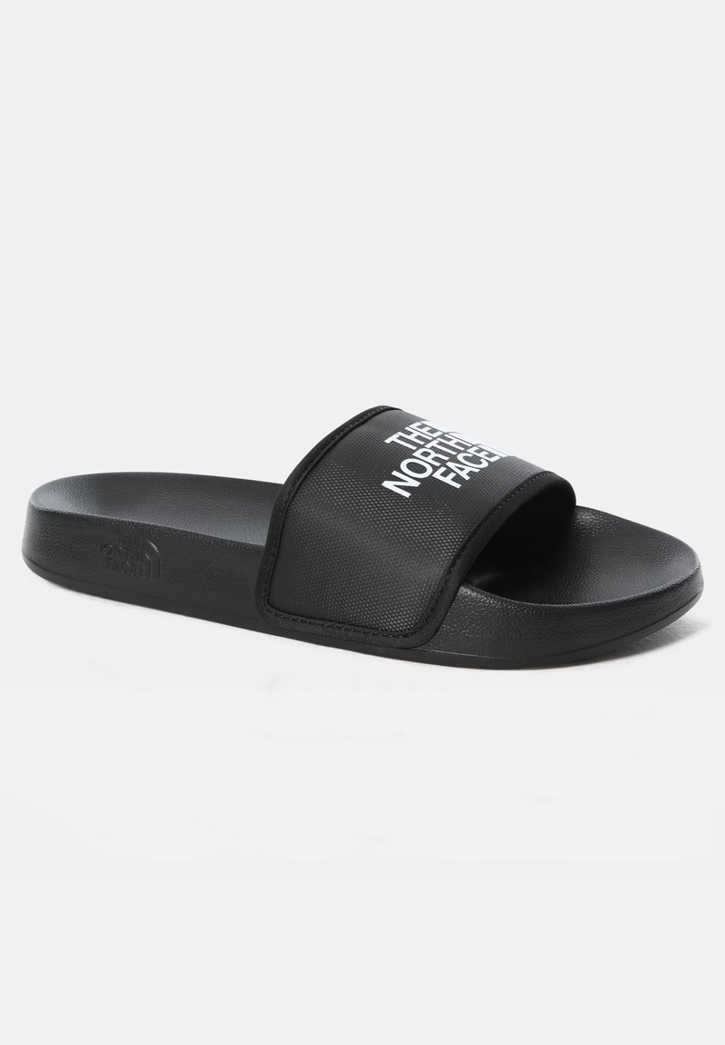 Black slide sandals with a textured synthetic strap featuring white brand text. Flat sole with a smooth finish and subtle branding detail.