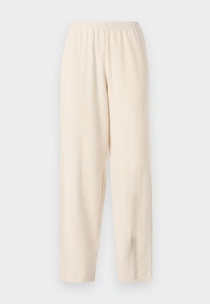 Krém színű, rugalmas derékú, laza szabású nadrág, sima textúrával és egyenes vonallal, látható zsebek vagy további részletek nélkül.