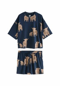 Marineblauwe two-piece outfit met een losvallende top met korte mouwen en shorts met elastische taille, beide bedekt met beige illustraties van Hooglandrunderen.