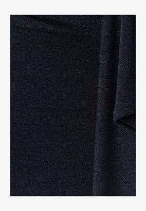 Tume sinine, tekstureeritud kangas peene sädelusega. Omab peeneid sooni ja pehmet, sujuvat viimistlust, luues särava ja ühtlase välimuse.