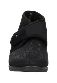 Pantofole nere con tomaia in tessuto morbido, superficie testurizzata e cinturino in velcro regolabile. Suola in gomma a profilo basso per stabilità e comfort.