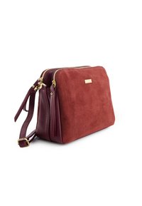 Burgundy leather bag with suede finish, gold-tone zippers, dual compartments, and adjustable strap. Textured with smooth and soft surfaces.