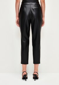 adL Tygbyxor - black