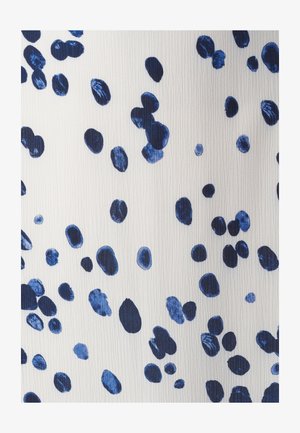 Tessuto testurizzato con un motivo astratto di forme ovali blu navy e azzurro chiaro su uno sfondo bianco, creando contrasto e interesse visivo.