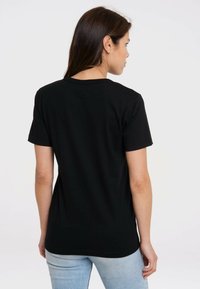 Black short-sleeved t-shirt made of cotton, featuring a classic crew neck and a smooth texture, with a simple design and no visible patterns.