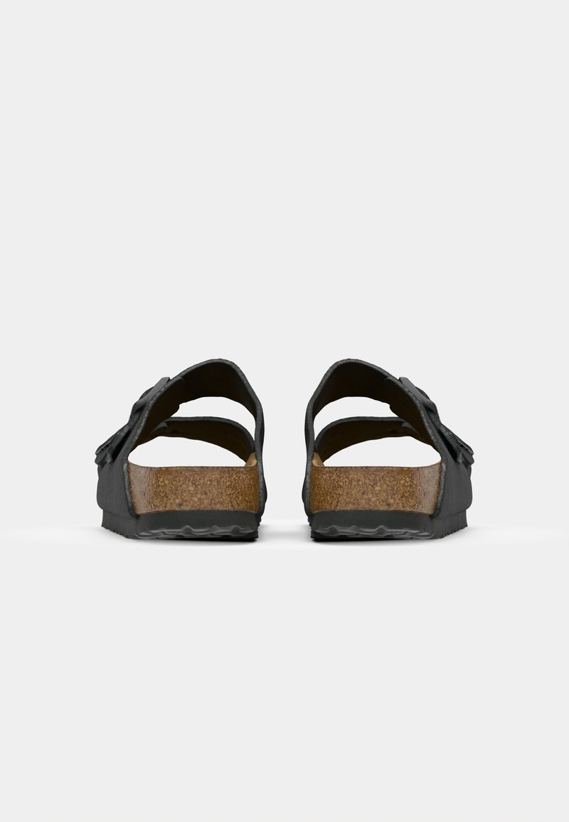 Schwarze Korksohlen-Sandalen mit zwei breiten Riemen, einem rückenfreien Design und einer strukturierten Gummisohle mit einem rutschfesten Muster.