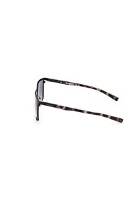 Ochelari de soare cu lentile gri și rame din acetat cu model țestoasă întunecată. Prezintă brațe subțiri cu brand și o textură moale.