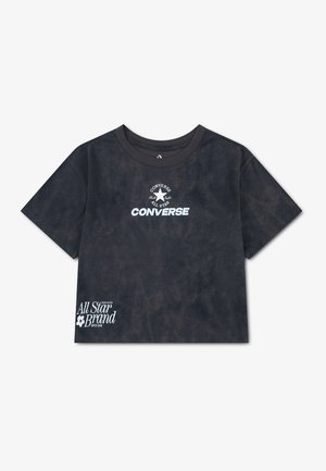 T-shirt Converse noir à manches courtes avec logo blanc et texte "Converse All Star" sur la poitrine et "All Star Brand" près de l'ourlet inférieur.