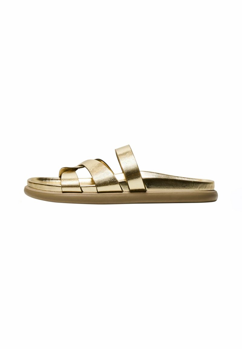 Gold slide sandal with multiple overlapping straps, a smooth metallic finish, and a sturdy flat sole. Simple design with no embellishments.