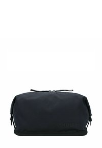 Funda de viaje suave rectangular negra con tiradores de doble cremallera y sutil logo de "Thule" en el lado frontal.