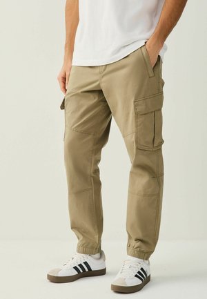 REGULAR TAPERED FIT -  - Cargo trousers - stone