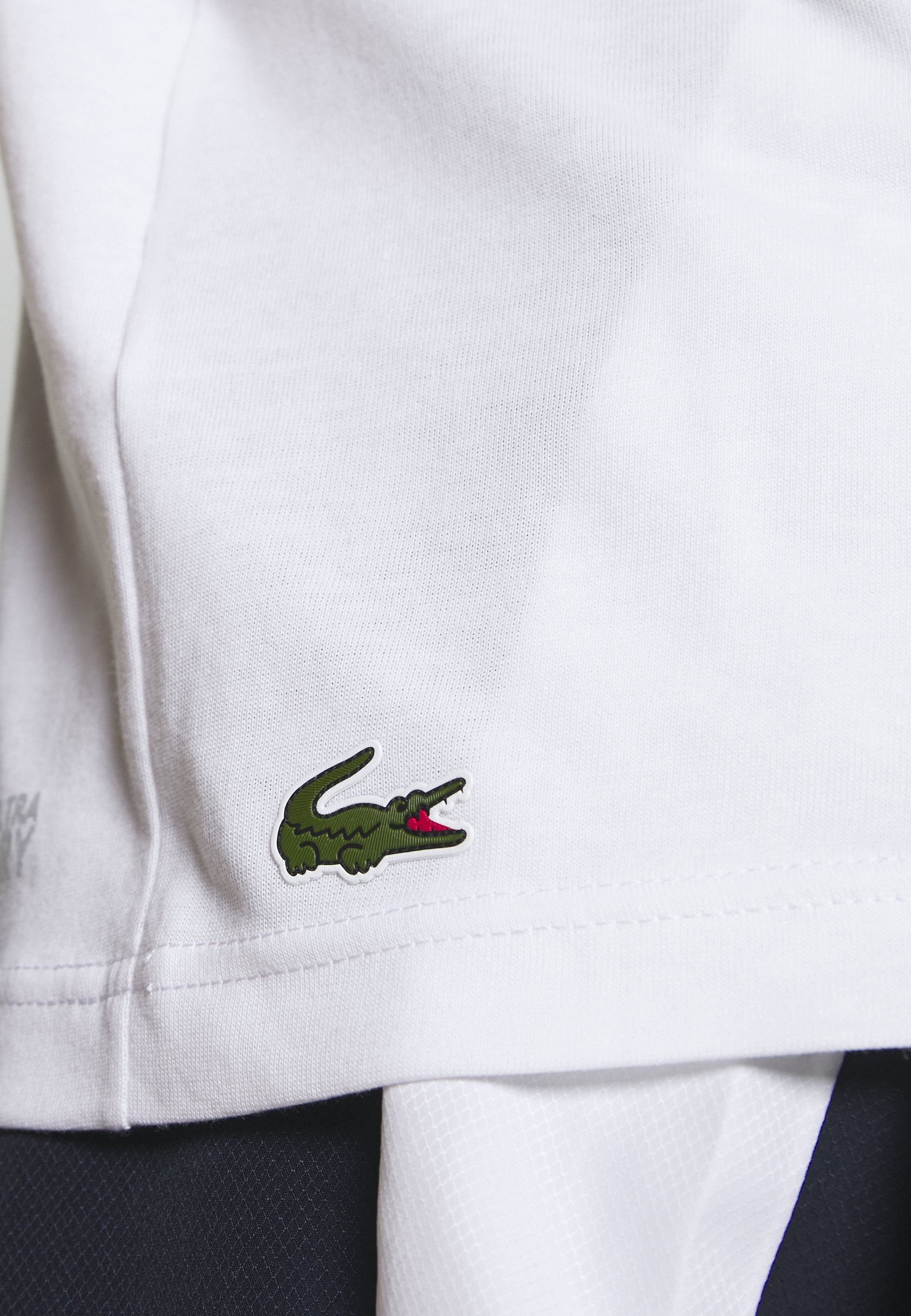 lacoste tiger logo