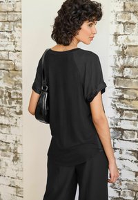 Next PLISSÉ SHORT SLEEVE STANDARD - Bluse - black