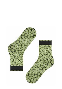 Grüne Socken mit Blattmuster auf schwarzem Grund, ausgestattet mit einem gerippten Bündchen und weicher Textur, entworfen für Komfort und Stil.