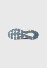 Running shoe sole with blue and white rubber tread pattern on a plain white background.
