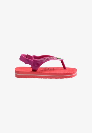 Barns lyserøde og koralrøde gummisandal med rem bagpå og tekstureret sål, mærket "Havaianas" på siden.