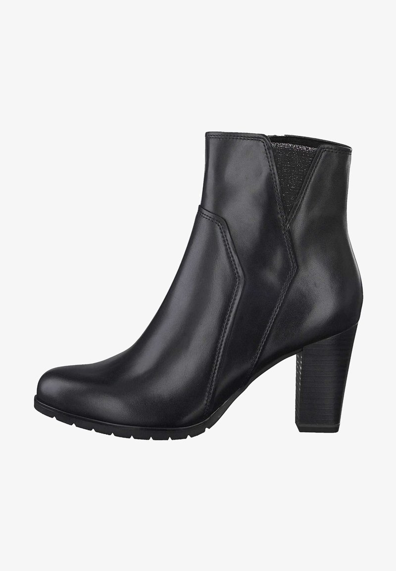 Bottine noire en cuir avec talon bloc, bout arrondi et empiècement latéral élastique pour un enfilage facile.